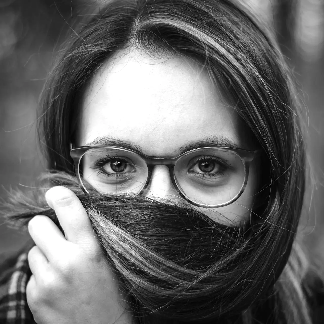 woman holding her hair during daytime